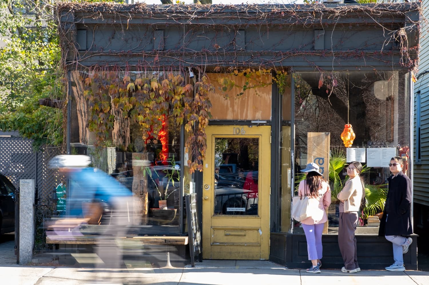 The sunlit exterior of Cicada Coffee Bar in Cambridge