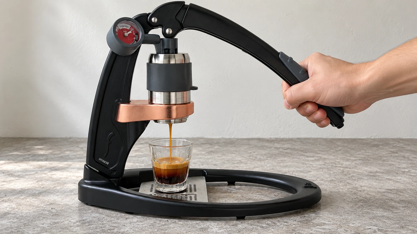 Lever espresso machine with the lever pulled down mid-shot