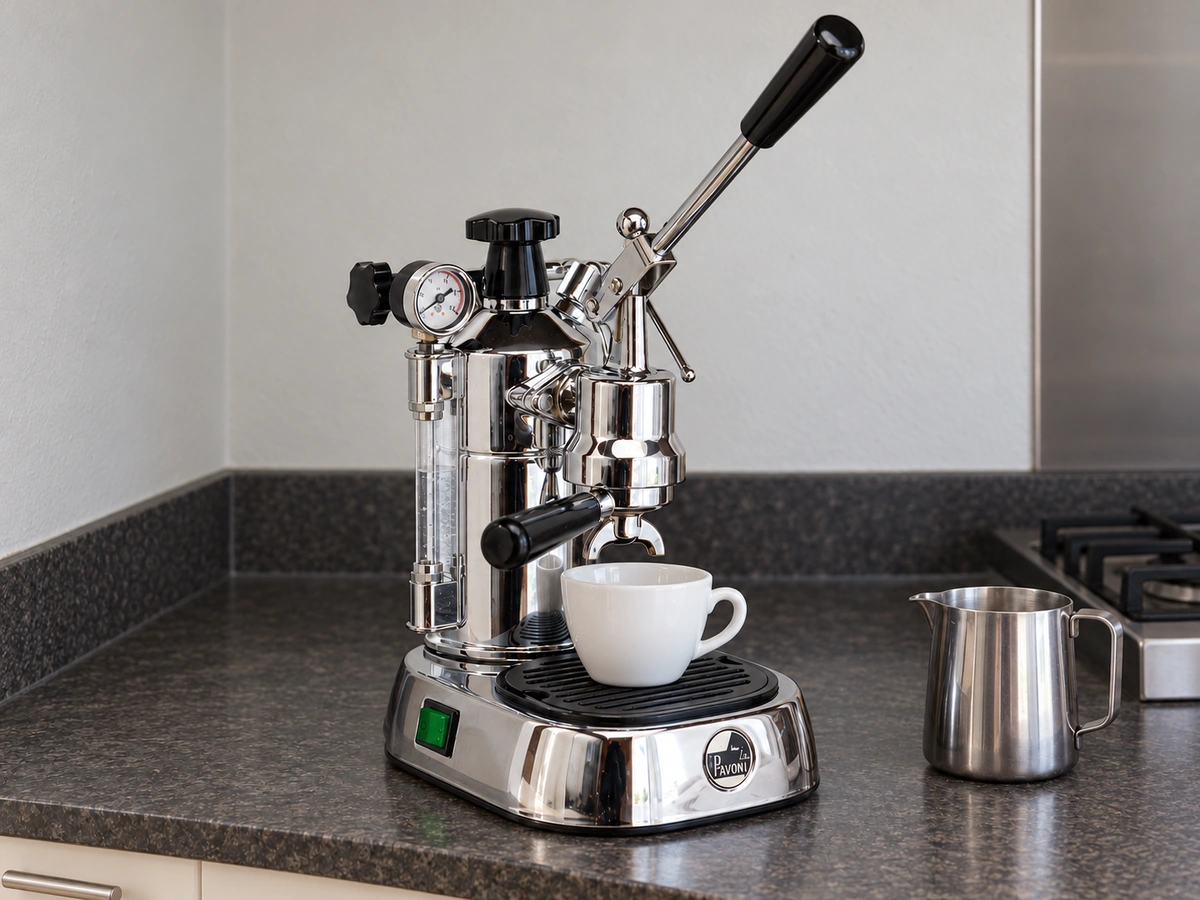 La Pavoni Professional lever machine in chrome on a kitchen counter, lever raised