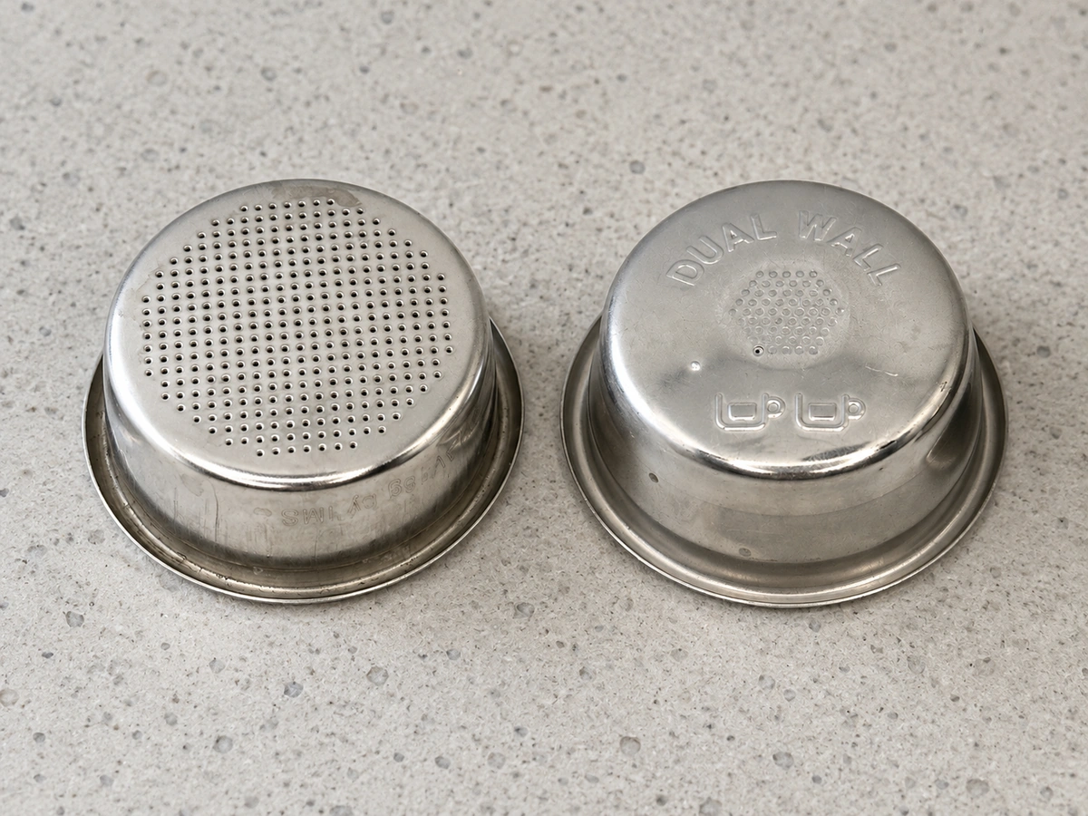 Non-pressurized and pressurized portafilter baskets side by side