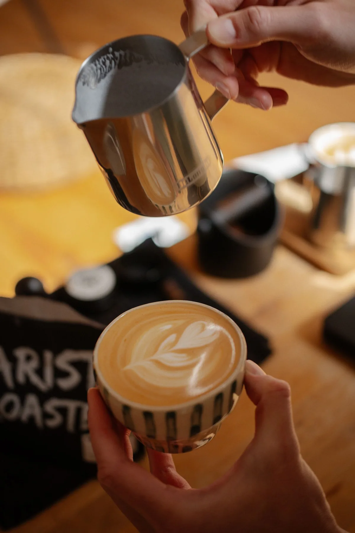 Close-up of latte art being poured